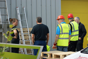 Group inspecting ladders on the Ladder Users & Inspectors Course